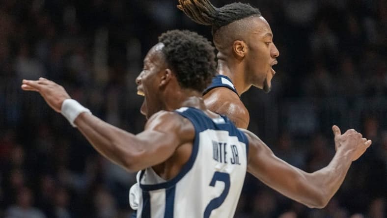 Butler Bulldogs guard Eric Hunter Jr. (2) and teammate Manny Bates (15) celebrate at Hinkle Fieldhouse, Wednesday, Nov. 30, 2022, during Butler s 76-64 win over Kansas State.