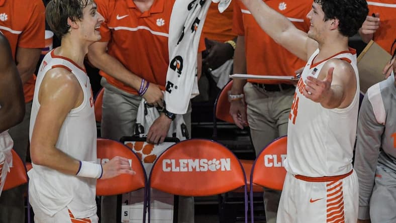 Clemson forward Hunter Tyson (5) and Clemson sophomore forward PJ Hall (24) celebrate in the closing second of the second half against Wake Forest at Littlejohn Coliseum Friday, December 2, 2022.

Clemson Basketball Vs Wake Forest University Acc