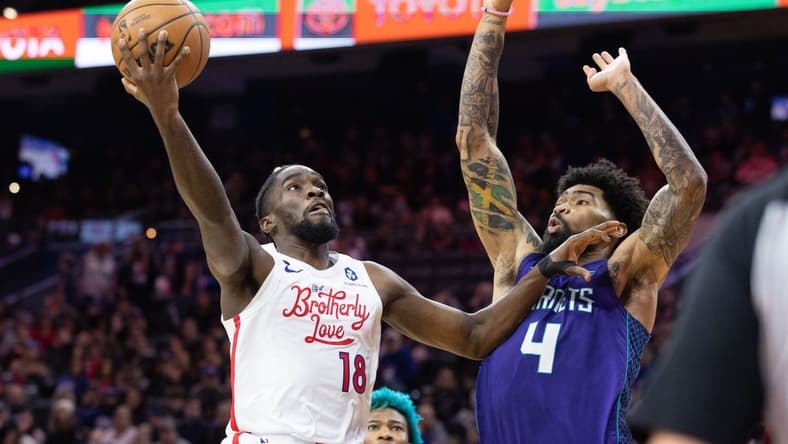 Dec 11, 2022; Philadelphia, Pennsylvania, USA; Philadelphia 76ers guard Shake Milton (18) drives against Charlotte Hornets center Nick Richards (4) during the fourth quarter at Wells Fargo Center. Mandatory Credit: Bill Streicher-USA TODAY Sports