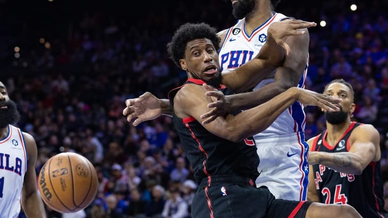 Dec 19, 2022; Philadelphia, Pennsylvania, USA; Toronto Raptors forward Thaddeus Young (21) looses control of the ball while driving against Philadelphia 76ers center Joel Embiid (21) during the second quarter at Wells Fargo Center. Mandatory Credit: Bill Streicher-USA TODAY Sports