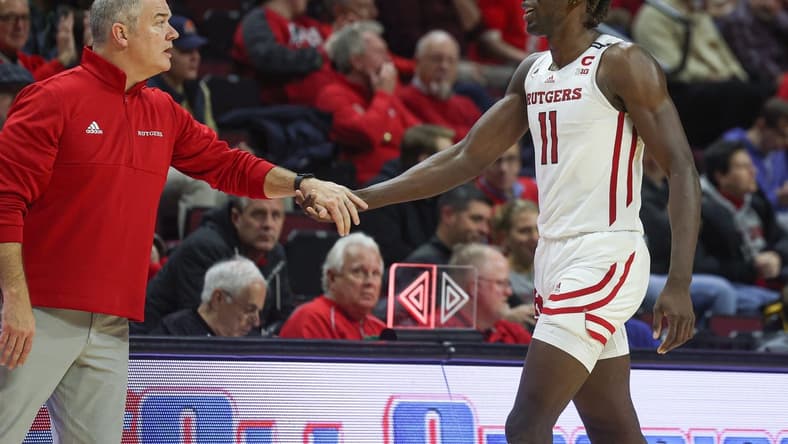 Dec 23, 2022; Piscataway, New Jersey, USA; Rutgers Scarlet Knights head coach Steve Pikiell greets center Clifford Omoruyi (11) after being subbed out during the second half against the Bucknell Bison at Jersey Mike's Arena. Mandatory Credit: Vincent Carchietta-USA TODAY Sports