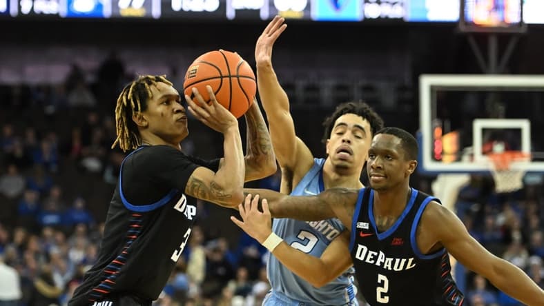 Dec 25, 2022; Omaha, Nebraska, USA;  DePaul Blue Demons guard Jalen Terry (3) scores a three point basket against the Creighton Bluejays in the second half at CHI Health Center Omaha. Mandatory Credit: Steven Branscombe-USA TODAY Sports
