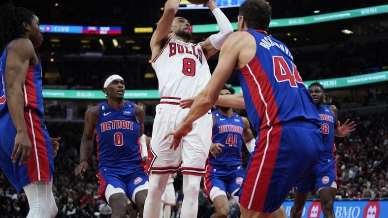 Dec 30, 2022; Chicago, Illinois, USA; Detroit Pistons forward Bojan Bogdanovic (44) defends Chicago Bulls guard Zach LaVine (8) during the second half at United Center. Mandatory Credit: David Banks-USA TODAY Sports