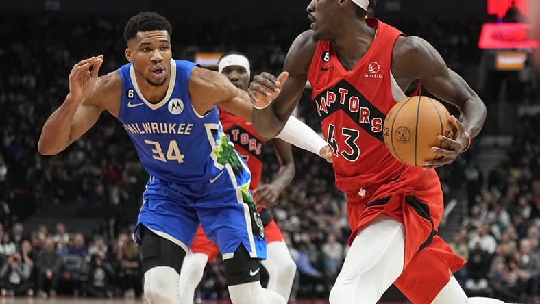 Jan 4, 2023; Toronto, Ontario, CAN; Toronto Raptors forward Pascal Siakam (43) drives to the net against Milwaukee Bucks forward Giannis Antetokounmpo (34) during the first half at Scotiabank Arena. Mandatory Credit: John E. Sokolowski-USA TODAY Sports