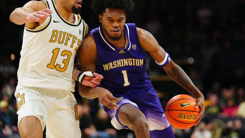 Jan 19, 2023; Boulder, Colorado, USA; Washington Huskies forward Keion Brooks (1) drives at Colorado Buffaloes guard J'Vonne Hadley (13) in the second half at the CU Events Center. Mandatory Credit: Ron Chenoy-USA TODAY Sports