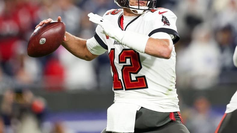 Jan 16, 2023; Tampa, Florida, USA; Tampa Bay Buccaneers quarterback Tom Brady (12) drops back to pass against the Dallas Cowboys in the third quarter during a wild card game at Raymond James Stadium. Mandatory Credit: Nathan Ray Seebeck-USA TODAY Sports