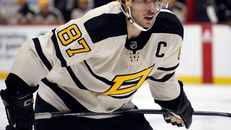 Jan 20, 2023; Pittsburgh, Pennsylvania, USA; Pittsburgh Penguins center Sidney Crosby (87) prepares to take a face-off against the Ottawa Senators during the third period at PPG Paints Arena. Mandatory Credit: Charles LeClaire-USA TODAY Sports