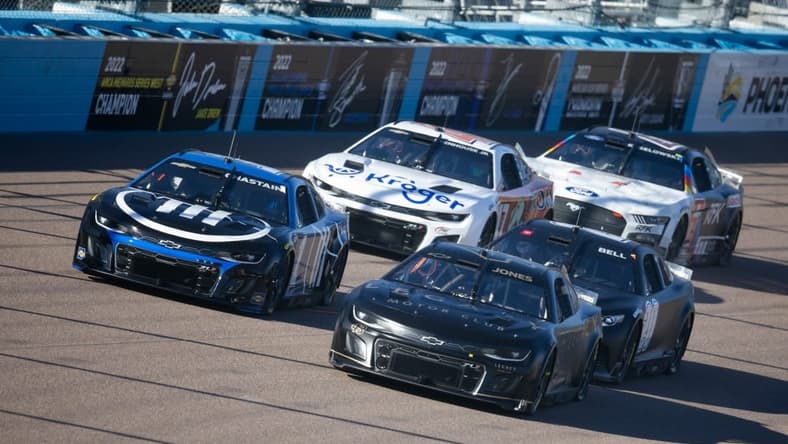 Jan 24, 2023; Avondale, AZ, USA; NASCAR Cup Series driver Erik Jones (43) races alongside Ross Chastain (1) during testing at Phoenix Raceway. Mandatory Credit: Mark J. Rebilas-USA TODAY Sports