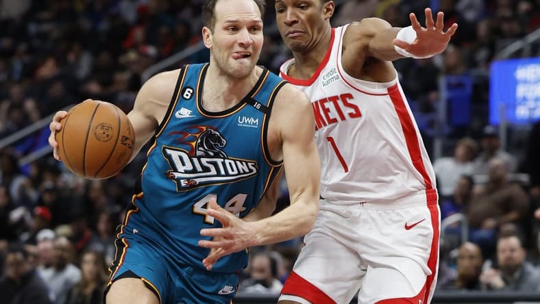 Jan 28, 2023; Detroit, Michigan, USA;  Detroit Pistons forward Bojan Bogdanovic (44) dribbles defended by Houston Rockets forward Jabari Smith Jr. (1) in the second half at Little Caesars Arena. Mandatory Credit: Rick Osentoski-USA TODAY Sports