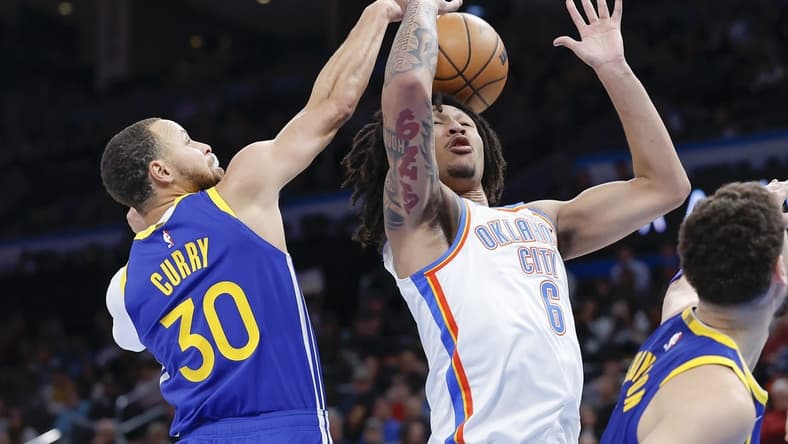 Jan 30, 2023; Oklahoma City, Oklahoma, USA; Golden State Warriors guard Stephen Curry (30) strips the ball away from Oklahoma City Thunder forward Jaylin Williams (6) during the second half at Paycom Center. Mandatory Credit: Alonzo Adams-USA TODAY Sports