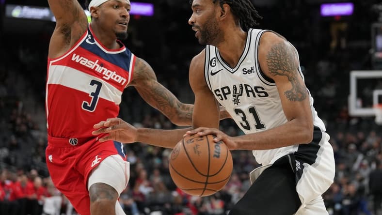 Jan 30, 2023; San Antonio, Texas, USA; San Antonio Spurs forward Keita Bates-Diop (31) drives against Washington Wizards guard Bradley Beal (3) in the second half at the AT&T Center. Mandatory Credit: Daniel Dunn-USA TODAY Sports