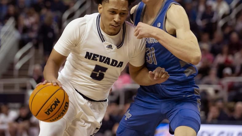 Nevada forward Darrion Williams (5) drives past Air Force forward Rytis Petraitis (31) during the first half of a basketball game played at Lawlor Events Center in Reno, Nev., Friday, Feb. 3, 2023.
Air Force At Nevada Basketball 01