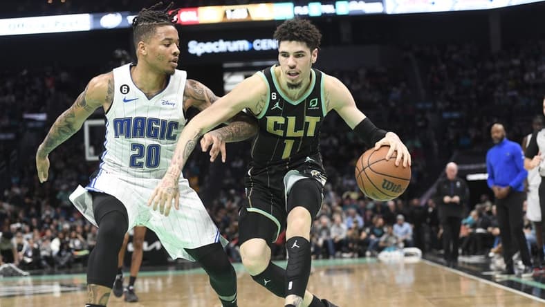 Feb 5, 2023; Charlotte, North Carolina, USA; Charlotte Hornets guard LaMelo Ball (1) drives past Orlando Magic guard Markelle Fultz (20) during the second half at the Spectrum Center. Mandatory Credit: Sam Sharpe-USA TODAY Sports