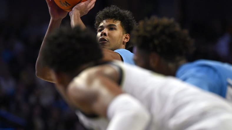 Feb 7, 2023; Winston-Salem, North Carolina, USA; North Carolina Tar Heels forward Puff Johnson (14) shoots a free throw during the second half at Lawrence Joel Veterans Memorial Coliseum. Mandatory Credit: William Howard-USA TODAY Sports