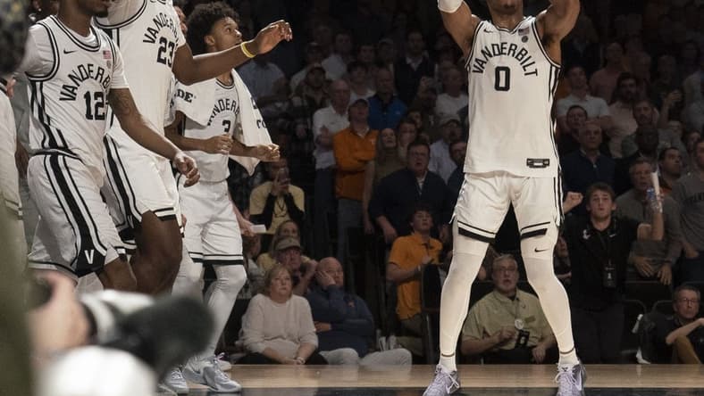 Feb 8, 2023; Nashville, Tennessee, USA;   Vanderbilt Commodores guard Tyrin Lawrence (0) shoots a three point basket at the buzzer to defeat the Tennessee Volunteers 66 to 65 at Memorial Gymnasium.  Mandatory Credit: George Walker IV - USA TODAY Sports