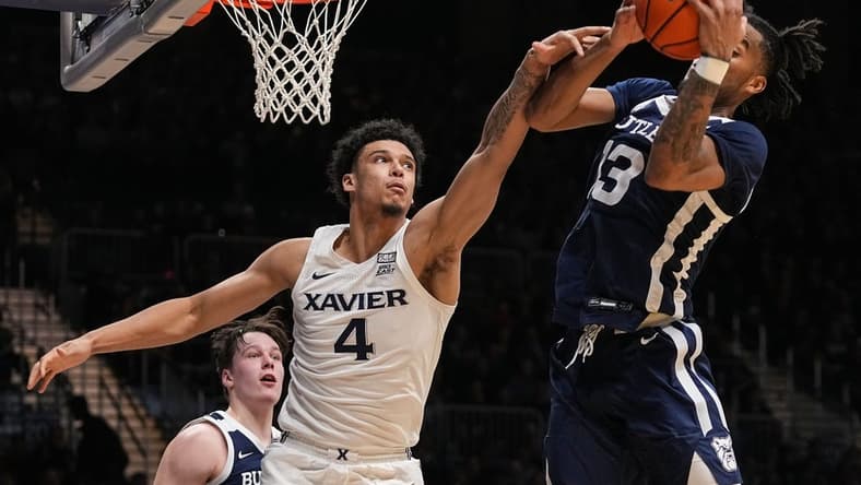 Xavier Musketeers forward Cesare Edwards (4) reaches for the ball against Butler Bulldogs guard Jayden Taylor (13) on Friday, Feb. 10, 2023 at Hinkle Fieldhouse in Indianapolis. The Butler Bulldogs defeated the Xavier Musketeers, 69-67.
Ncaa Basketball Butler Xavier Hoops Xavier Musketeers At Butler Bulldogs