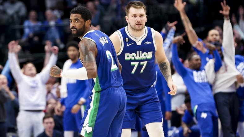 Feb 13, 2023; Dallas, Texas, USA;  Dallas Mavericks guard Kyrie Irving (2) celebrates with Dallas Mavericks guard Luka Doncic (77) during the fourth quarter against the Minnesota Timberwolves at American Airlines Center. Mandatory Credit: Kevin Jairaj-USA TODAY Sports