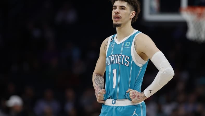 Feb 15, 2023; Charlotte, North Carolina, USA; Charlotte Hornets guard LaMelo Ball (1) stands on the court during the second half against the San Antonio Spurs at Spectrum Center. The Charlotte Hornets won 120-110. Mandatory Credit: Nell Redmond-USA TODAY Sports