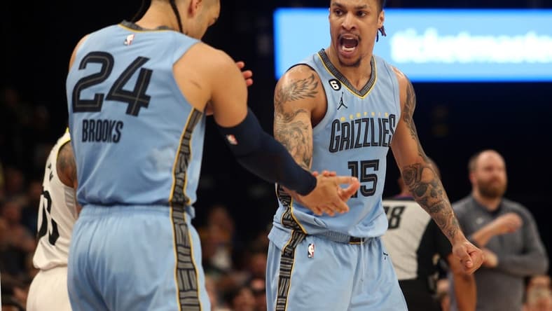Feb 15, 2023; Memphis, Tennessee, USA; Memphis Grizzlies forward Brandon Clarke (15) reacts with forward Dillon Brooks (24) after forcing a turnover during the second half at FedExForum. Mandatory Credit: Petre Thomas-USA TODAY Sports