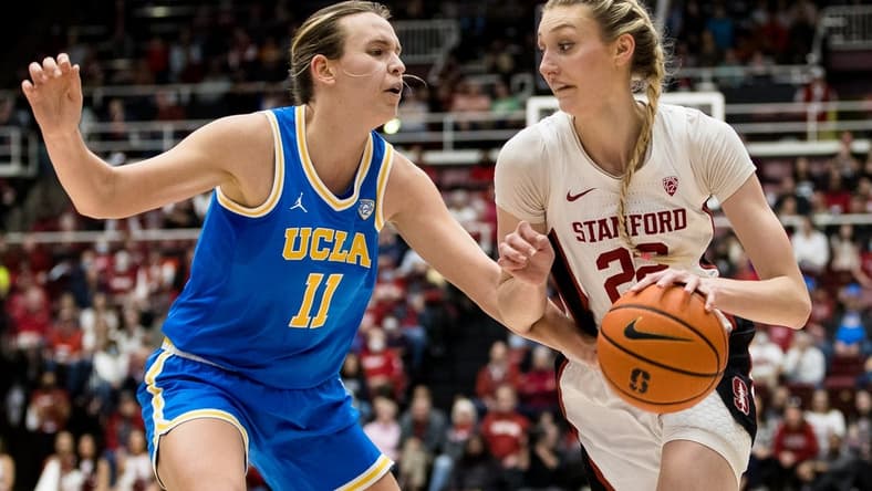 Feb 20, 2023; Stanford, California, USA; Stanford Cardinal forward Cameron Brink (22) moves past UCLA Bruins forward Emily Bessoir (11) during the first half at Maples Pavilion. Mandatory Credit: John Hefti-USA TODAY Sports