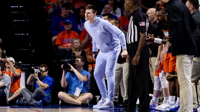 Feb 22, 2023; Gainesville, Florida, USA; Florida Gators forward Colin Castleton (12) cheers from the sideline during the first half against the Kentucky Wildcats at Exactech Arena at the Stephen C. O'Connell Center. Mandatory Credit: Matt Pendleton-USA TODAY Sports