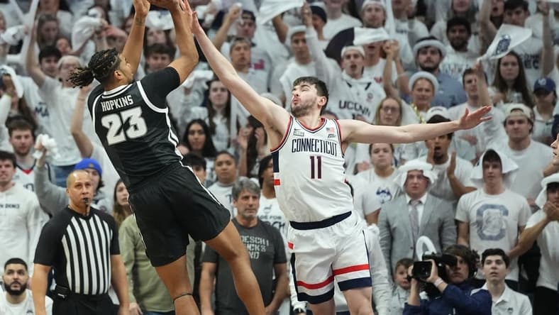 Feb 22, 2023; Storrs, Connecticut, USA; Providence Friars forward Bryce Hopkins (23) shoots the ball against Connecticut Huskies forward Alex Karaban (11) during the second half at Harry A. Gampel Pavilion. Mandatory Credit: Gregory Fisher-USA TODAY Sports