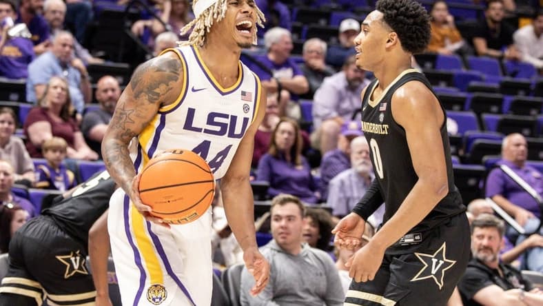 Feb 22, 2023; Baton Rouge, Louisiana, USA; LSU Tigers guard Adam Miller (44) reacts to a play against Vanderbilt Commodores guard Tyrin Lawrence (0) during the second half at Pete Maravich Assembly Center. Mandatory Credit: Stephen Lew-USA TODAY Sports