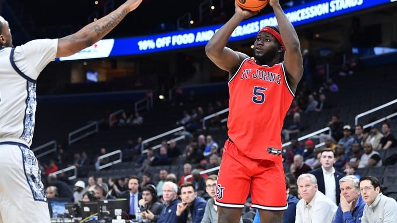 Feb 22, 2023; Washington, District of Columbia, USA; St. John's Red Storm guard Dylan Addae-Wusu (5) attempts a shot against the Georgetown Hoyas during the first half at Capital One Arena. Mandatory Credit: Brad Mills-USA TODAY Sports