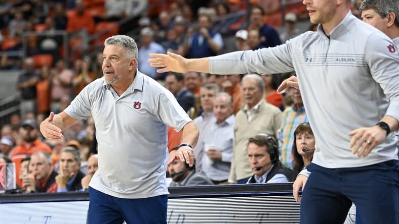 Feb 22, 2023; Auburn, Alabama, USA;  Auburn Tigers head coach Bruce Pearl (left) reacts during the second half against the Mississippi Rebels at Neville Arena. Mandatory Credit: Julie Bennett-USA TODAY Sports