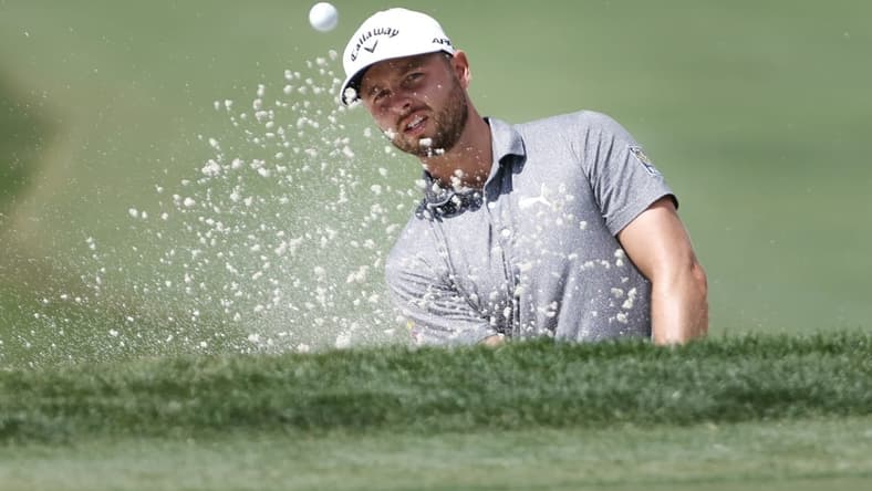 Feb 23, 2023; Palm Beach Gardens, Florida, USA; Adam Svensson plays a shot from a bunker on the third hole during the first round of the Honda Classic golf tournament. Mandatory Credit: Sam Navarro-USA TODAY Sports