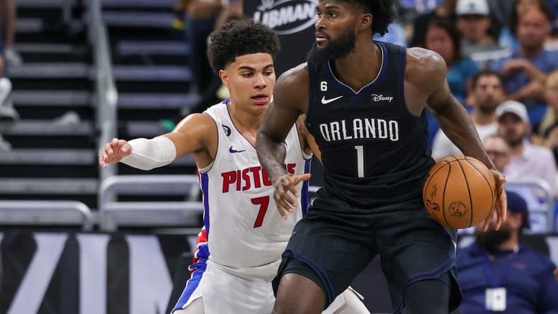 Feb 23, 2023; Orlando, Florida, USA; Detroit Pistons guard Killian Hayes (7) defends Orlando Magic forward Jonathan Isaac (1) during the second half at Amway Center. Mandatory Credit: Mike Watters-USA TODAY Sports