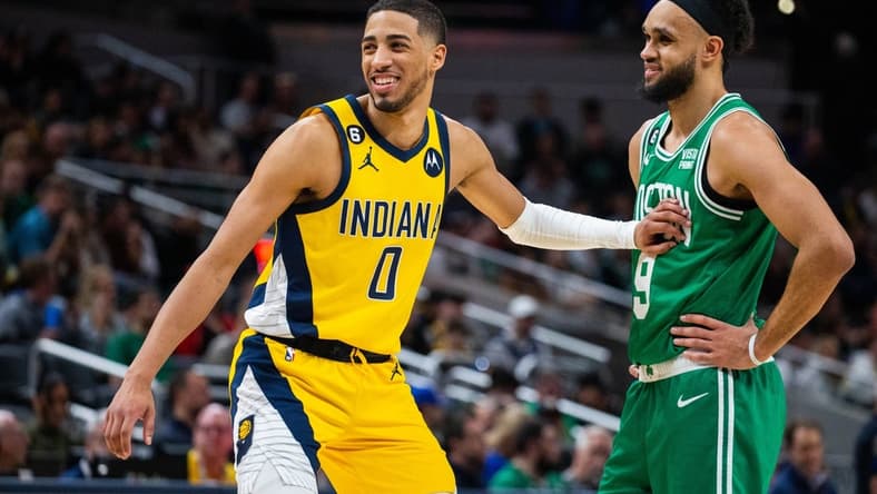 Feb 23, 2023; Indianapolis, Indiana, USA; Indiana Pacers guard Tyrese Haliburton (0) and Boston Celtics guard Derrick White (9) in the second half at Gainbridge Fieldhouse. Mandatory Credit: Trevor Ruszkowski-USA TODAY Sports