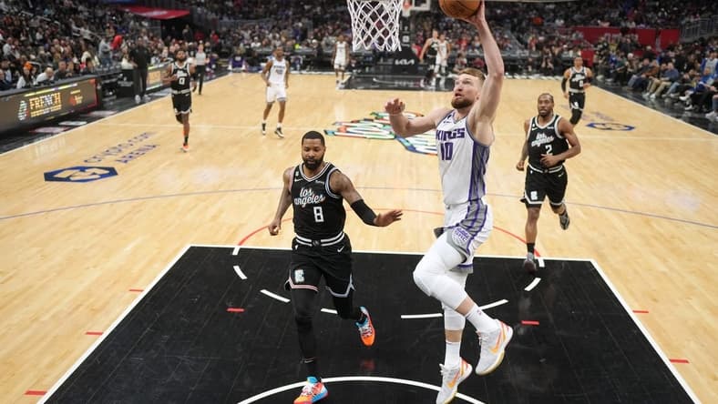 Feb 24, 2023; Los Angeles, California, USA; Sacramento Kings forward Domantas Sabonis (10) shoots the ball against the LA Clippers in the second half at Crypto.com Arena. The Kings defeated the Clippers 176-175 in double overtime. Mandatory Credit: Kirby Lee-USA TODAY Sports