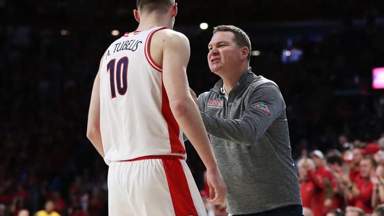 Feb 25, 2023; Tucson, Arizona, USA; Arizona Wildcats forward Azuolas Tubelis (10) and head coach Tommy Lloyd speak on the sidelines against Arizona State Sun Devils in the second half at McKale Center. Mandatory Credit: Zachary BonDurant-USA TODAY Sports