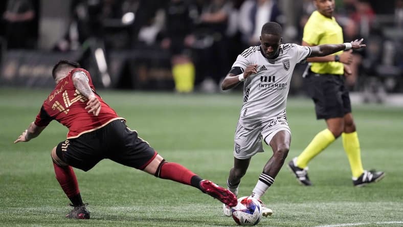 Feb 25, 2023; Atlanta, Georgia, USA; Atlanta United FC midfielder Franco Ibarra (14) defends against San Jose Earthquakes midfielder Jamiro Monteiro (35) in the second half at Mercedes-Benz Stadium. Mandatory Credit: Dale Zanine-USA TODAY Sports