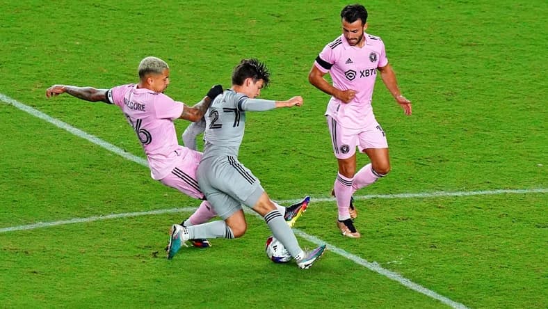 Feb 25, 2023; Fort Lauderdale, Florida, USA; Inter Miami CF midfielder Gregore (left) battles for the ball against CF Montreal midfielder Sean Rea (27) during the second half at DRV PNK Stadium. Mandatory Credit: John David Mercer-USA TODAY Sports