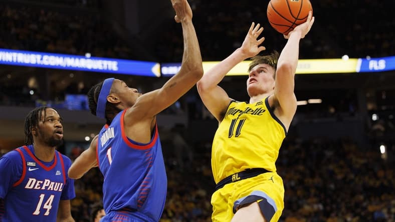 Feb 25, 2023; Milwaukee, Wisconsin, USA; Marquette Golden Eagles guard Tyler Kolek (11) shoots against DePaul Blue Demons forward Javan Johnson (1) during the second half at Fiserv Forum. Mandatory Credit: Jeff Hanisch-USA TODAY Sports