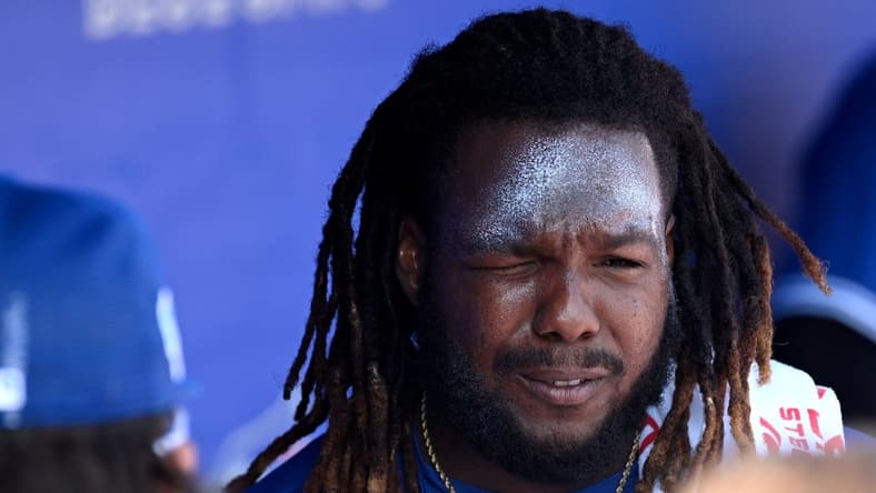 Feb 26, 2023; Dunedin, Florida, USA; Toronto Blue Jays designated hitter Vladimir Guerrero Jr. (27) applies sunscreen before the start of the game against the New York Yankees at TD Ballpark. Mandatory Credit: Jonathan Dyer-USA TODAY Sports