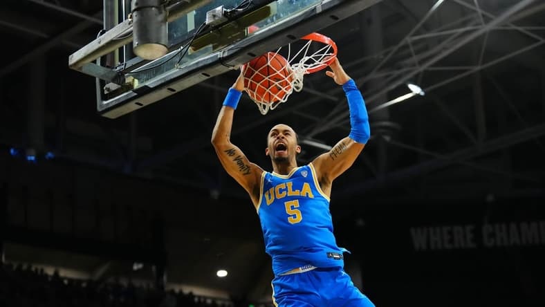 Feb 26, 2023; Boulder, Colorado, USA; UCLA Bruins guard Amari Bailey (5) finishes off a basket in the second half against the Colorado Buffaloes at the CU Events Center. Mandatory Credit: Ron Chenoy-USA TODAY Sports