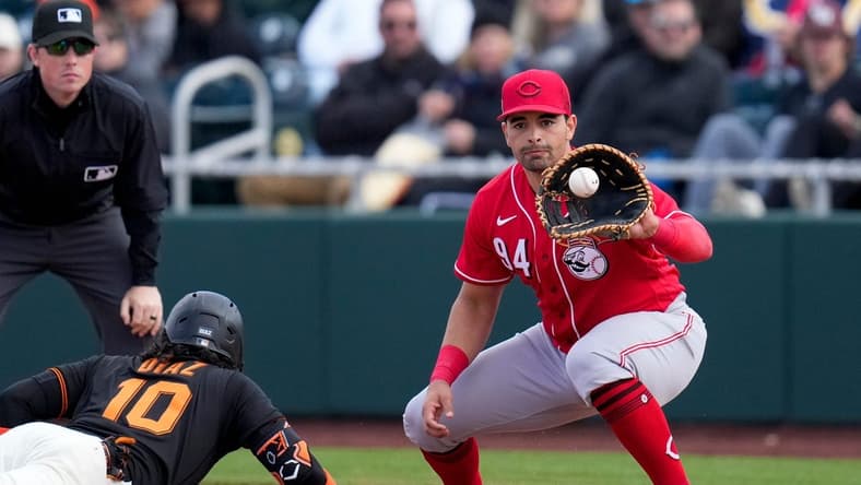 San Francisco Giants second baseman Isan Diaz (10) dives back against a pickoff tag from Cincinnati Reds first baseman Christian Encarnacion-Strand (94) in the sixth inning of the MLB Cactus League spring training game between the San Francisco Giants and the Cincinnati Reds at Scottsdale Stadium in Goodyear, Ariz., on Sunday, Feb. 26, 2023. The Giants came back in the ninth inning to win on a walk-off single off the bat of Will Wilson.

Cincinnati Reds At San Francisco Giants Spring Training