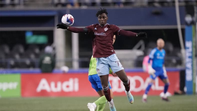 Feb 26, 2023; Seattle, Washington, USA; Colorado Rapids forward Darren Yapi (77) jumps to control the ball in the second half against the Seattle Sounders FC at Lumen Field. Mandatory Credit: Kirby Lee-USA TODAY Sports