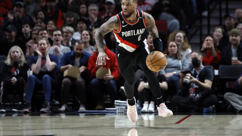 Feb 26, 2023; Portland, Oregon, USA; Portland Trail Blazers point guard Damian Lillard (0) dribbles the ball on a fast break during the first half against the Houston Rockets at Moda Center. Mandatory Credit: Soobum Im-USA TODAY Sports