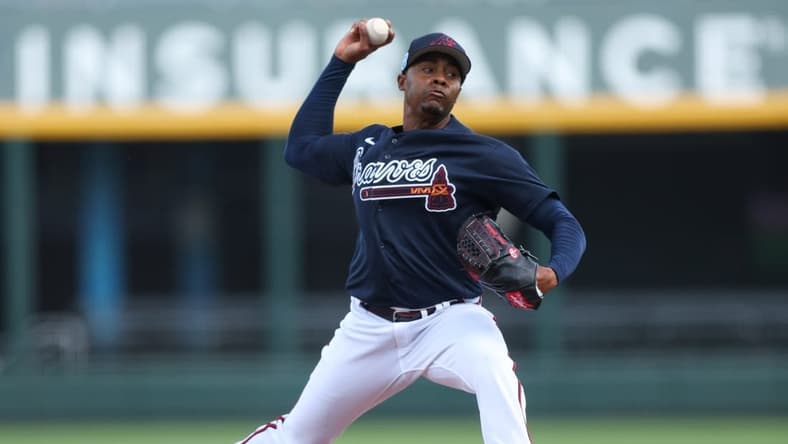Feb 27, 2023; North Port, Florida, USA; Atlanta Braves relief pitcher Raisel Iglesias (26) throws a pitch against the Toronto Blue Jays in the fifth inning during spring training at CoolToday Park. Mandatory Credit: Nathan Ray Seebeck-USA TODAY Sports