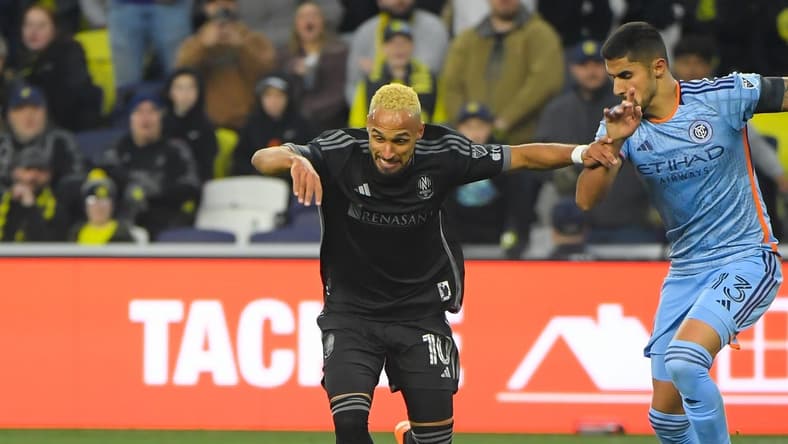 Feb 25, 2023; Nashville, Tennessee, USA;  Nashville SC midfielder Hany Mukhtar (10) dribbles against the New York City during the second half at Geodis Park. Mandatory Credit: Steve Roberts-USA TODAY Sports