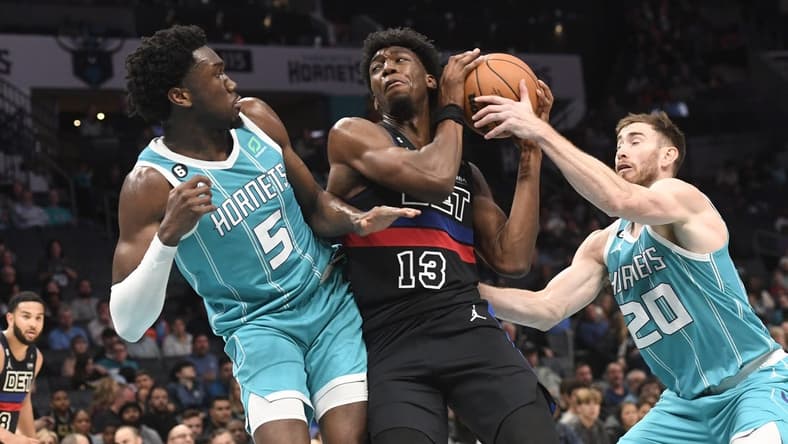 Feb 27, 2023; Charlotte, North Carolina, USA; Detroit Pistons center James Wiseman (13) gets a rebound from Charlotte Hornets center Mark Williams (5) and forward Gordon Hayward (20) during the second half at the Spectrum Center. Mandatory Credit: Sam Sharpe-USA TODAY Sports