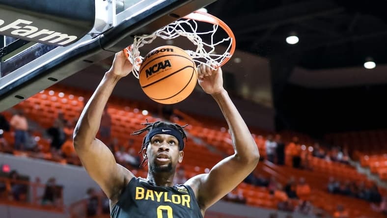 Baylor forward Flo Thamba (0) dunks the ball in the second half during a college basketball game between the Oklahoma State Cowboys (OSU) and the Baylor Bears at Gallagher-Iba Arena in Stillwater, Okla., Monday, Feb. 27, 2023.

Osu Vs Baylor