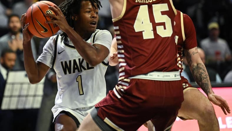 Feb 28, 2023; Winston-Salem, North Carolina, USA; Wake Forest Demon Deacons guard Tyree Appleby (1) controls the ball against Boston College Eagles guard Mason Madsen (45) during the first half at Lawrence Joel Veterans Memorial Coliseum. Mandatory Credit: William Howard-USA TODAY Sports