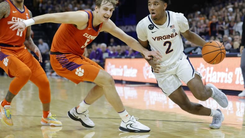 Feb 28, 2023; Charlottesville, Virginia, USA; Virginia Cavaliers guard Reece Beekman (2) drives to the basket as Clemson Tigers forward Hunter Tyson (5) defends in the second half  at John Paul Jones Arena. Mandatory Credit: Geoff Burke-USA TODAY Sports
