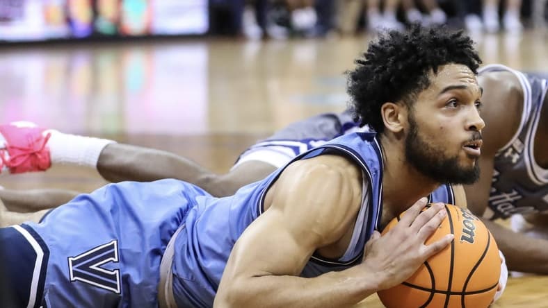 Feb 28, 2023; Newark, New Jersey, USA;  Villanova Wildcats guard Caleb Daniels (14) lays on the floor after recovering a loose ball in the second half against the Seton Hall Pirates at Prudential Center. Mandatory Credit: Wendell Cruz-USA TODAY Sports