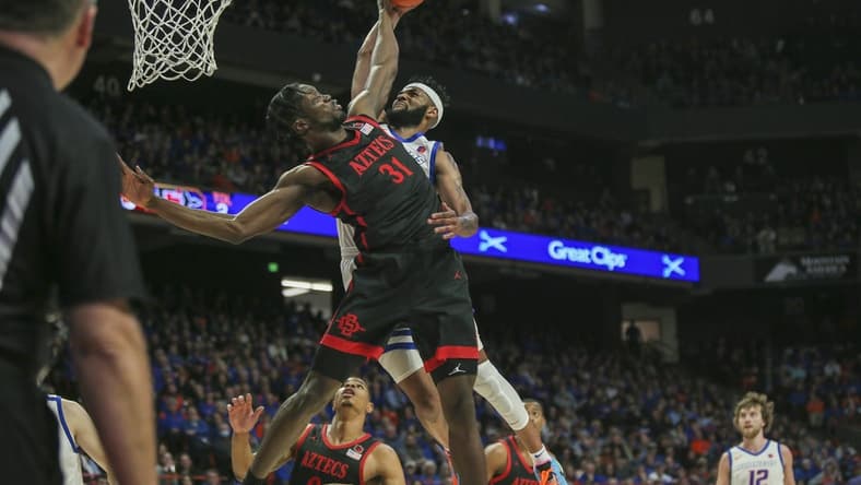 Feb 28, 2023; Boise, Idaho, USA; San Diego State Aztecs forward Nathan Mensah (31) blocks the dunk of Boise State Broncos forward Naje Smith (23) during the second half at ExtraMile Arena. Boise State upsets San Diego State 66-60. Mandatory Credit: Brian Losness-USA TODAY Sports